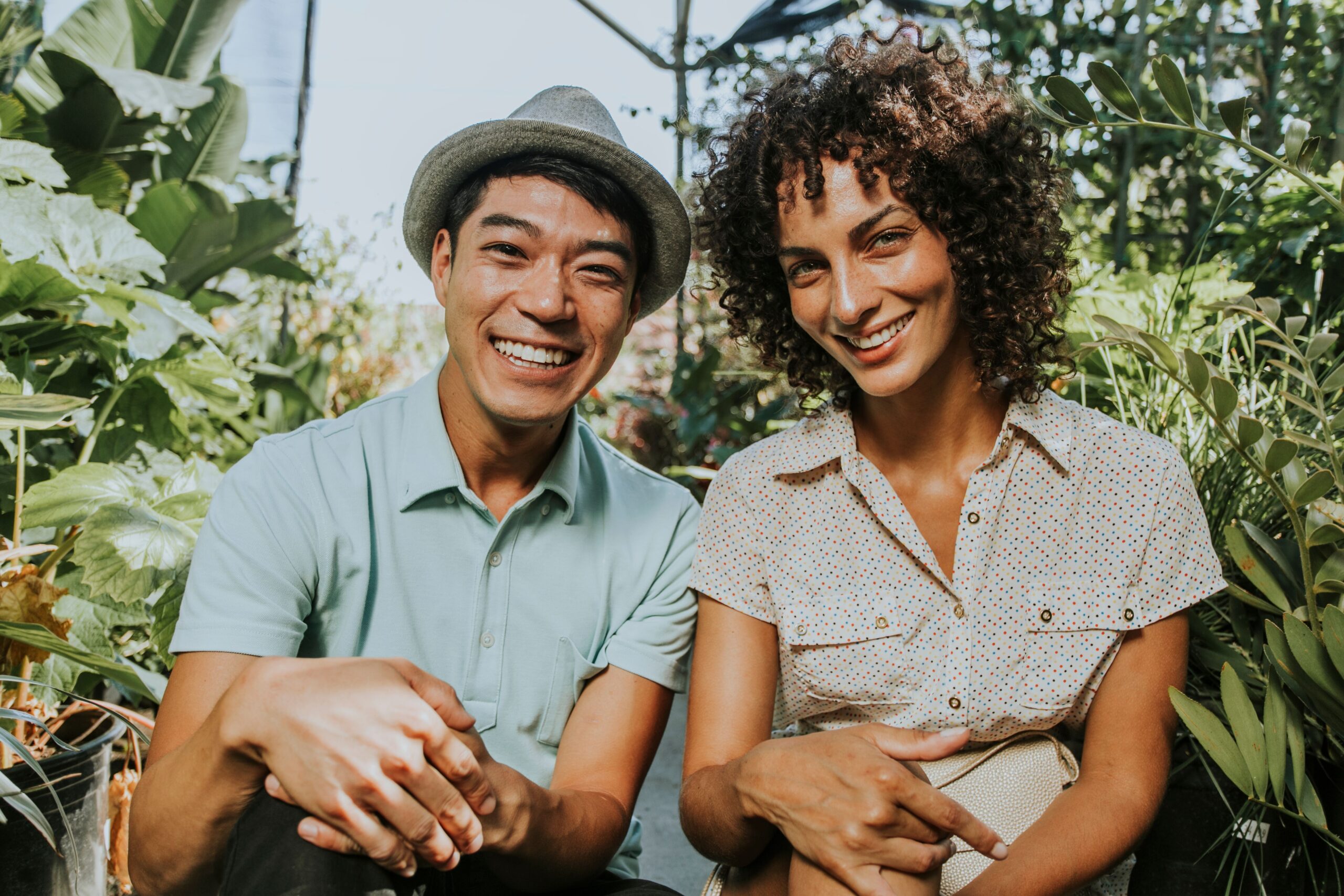 Two friends sitting outdoors in the summer